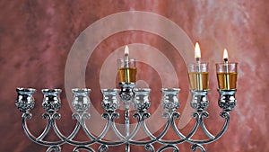 Second day of Hanukkah with burning Hanukkah candles Hanukkiah traditional Candelabra