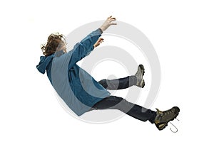 A second before falling - young man falling down with bright emotions and expression photo