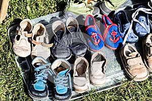 Second hand baby and child shoes for reusing or recycling photo