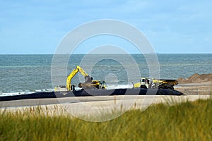 Construction of a wind farm on Maasvlakte reclaimed in the North Sea photo