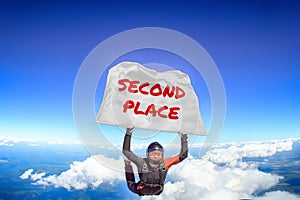 Second place. Flag in skydiving. People in free fall.Teampleat skydiver. Extreme sport.