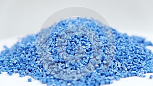 Secondary granule made of polypropylene, Blue Plastic pellets crumbles to the table . Plastic raw materials in granules for indust