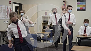 Secondary school students in UK wear masks as they enter class and sit down