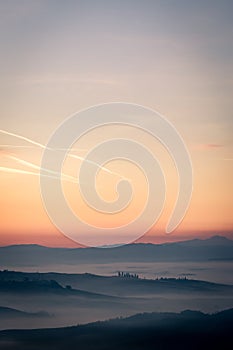 Seconds to sunrise, misty Tuscany, Italy