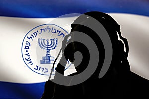 Secret agent of the Israeli intelligence eavesdropping on conversations, spy and special agent, the Israeli flag of the special