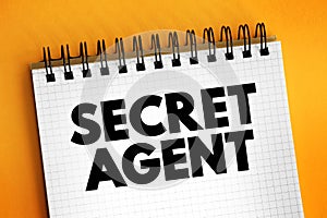Secret Agent is a spy acting for a country, text concept on notepad