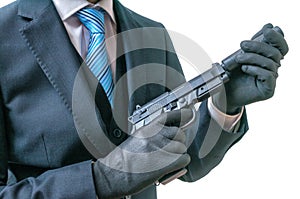 Secret agent or spy holds pistol with silencer in hands. Isolated on white. photo