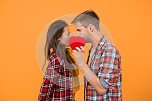Secret kiss. Intimacy. Man and girl romantic date. Couple in love. Sexy couple checkered shirts. Heart full of love