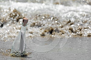 secret message in the glass bottle the waves of the sea beached on the shore