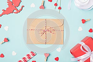 Secret message from lover concept. Overhead close up view photo image of tied with ribbon craft envelope and desk decorated with