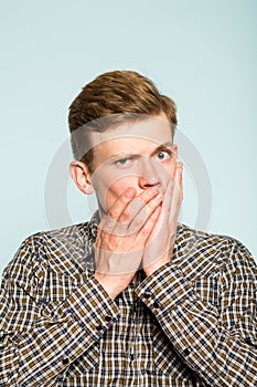 Secret mystery man cover mouth hands not speaking