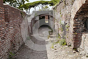 Secret paths and suggestive views in the Roman ruins at Ostia Antica, Rome Italy