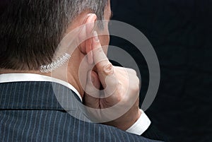 Secret Service Agent Listens To Earpiece, Shoulder