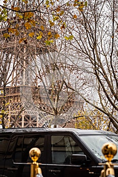 Secret service atmosphere at the foot of the Eiffel Tower in Paris in autumn