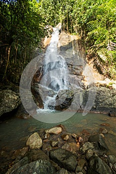 Secret tropical waterfall in jungle on a Samui island.