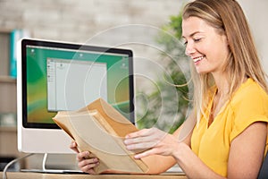 secretary sorting bundle envelopes in office