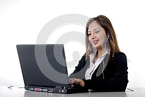 Secretary typing wearing headset