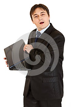 Secretive modern businessman hiding laptops screen