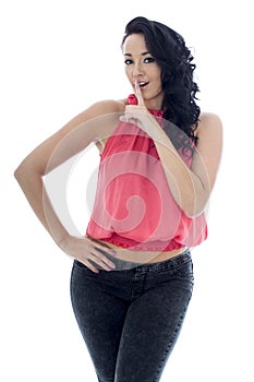 Secretive Young Hispanic Woman Posing In A Pink Top and Black Jeans