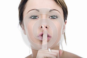 Secretive Young Woman with Finger on Lips