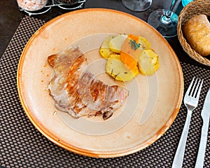 Secreto port meat with potato and sweetpotato puree photo