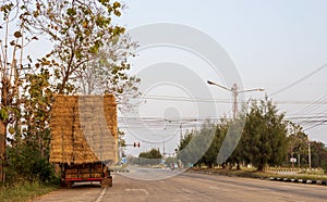 A section of an agricultural vehicle loaded with bales of straw