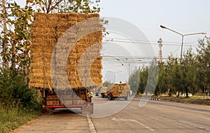 A section of an agricultural vehicle loaded with bales of straw