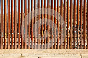 United States Border Wall with Slogans and Art from Nogales Sonora Mexico photo