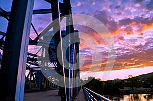 Section of the Lewiston - Clarkston blue bridge against vibrant twilight sky on the border of Idaho and Washington states