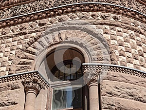 Another view of a section of one of the ontside with ornate design old court house Toronto Ontario Canada