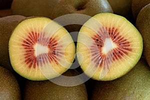 A section of a red kiwi cut in half.