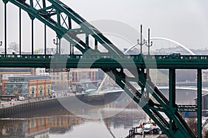 Section of the Tyne Bridge in the foreground and Millenium Bridge in the distance at Newcastle Quayside