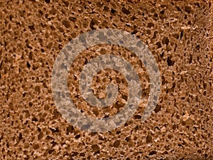 Sectional texture of rye flour bread. Crumb. Background, surface. Food.