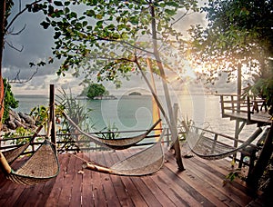 Seculed terrace with wooden hammocks