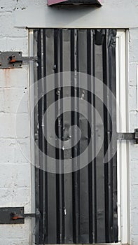 Secure grey door on a lock-up