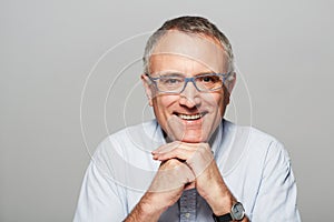 Secure in his retirement. Studio portrait of a mature man smiling at the camera.