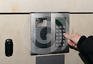 Hands Pressing on Intercom