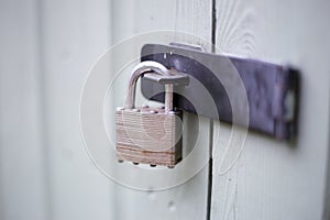 Secure padlock on willow garden shed