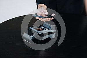 Secure payment technology concept and service charge, customers are using their phone to pay using paywave technology by