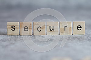 Secure word written on wood cube