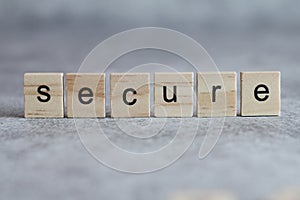 Secure word written on wood cube photo