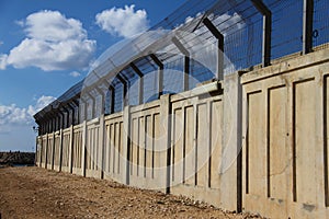A secured industrial zone with concrete fence
