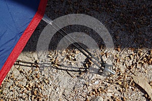 Securing a camping tent to the ground