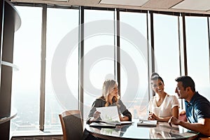 Securing finance for their future dreams. a young couple meeting with a financial planner in a modern office.