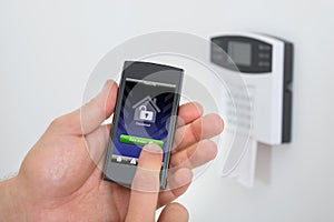 Security alarm keypad with person arming the system