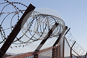 Security with a barbed wire fence. Protection concept design.