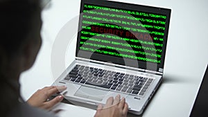 Security breach attack on laptop computer, woman working in office, cybercrime