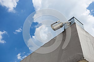 Security camera on blue sky