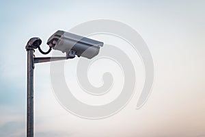 Security camera on blue sky