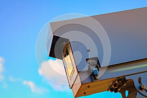 Security camera on blue sky background, camera cctv